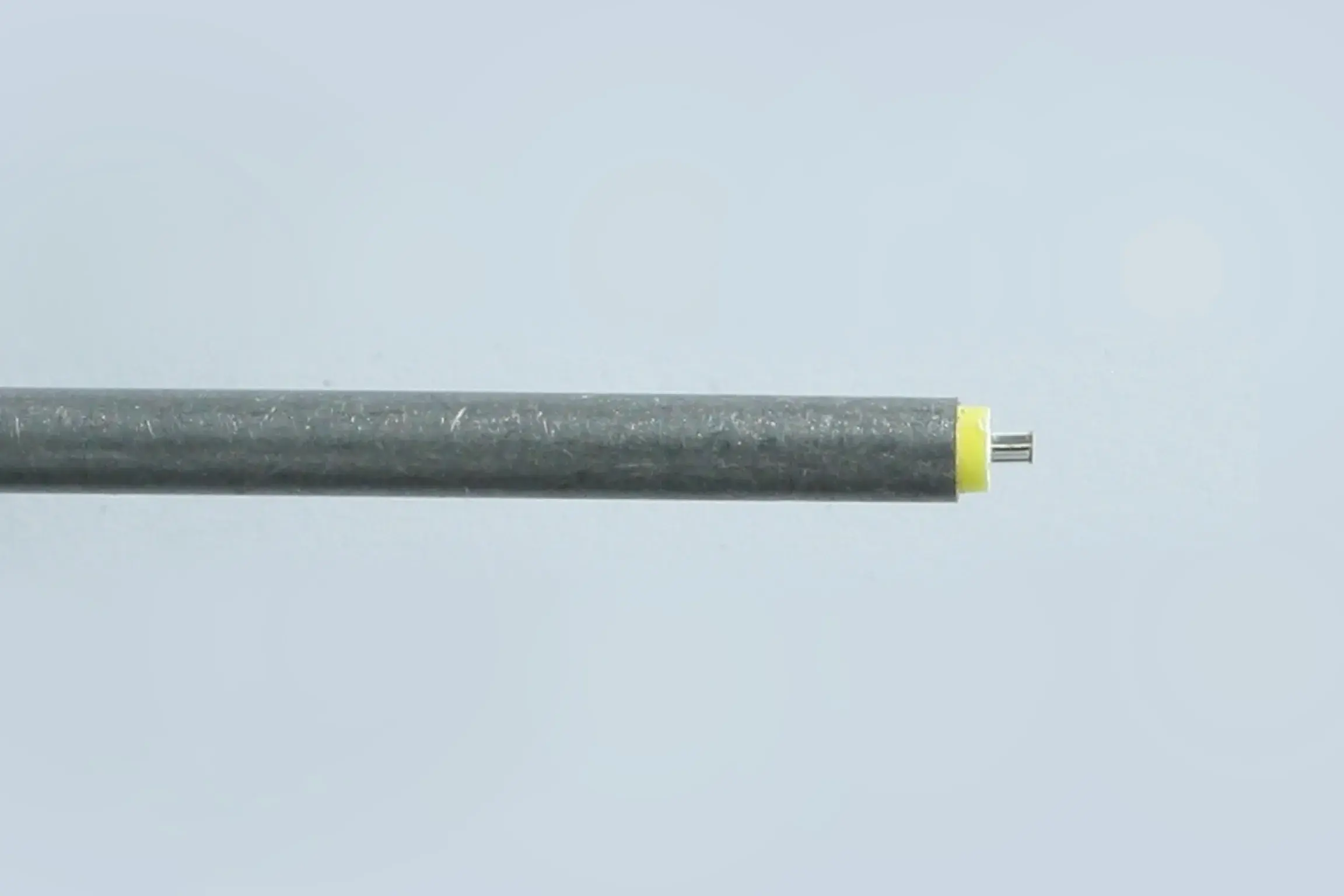 Silver wire with two wrapper of color black and yellow.