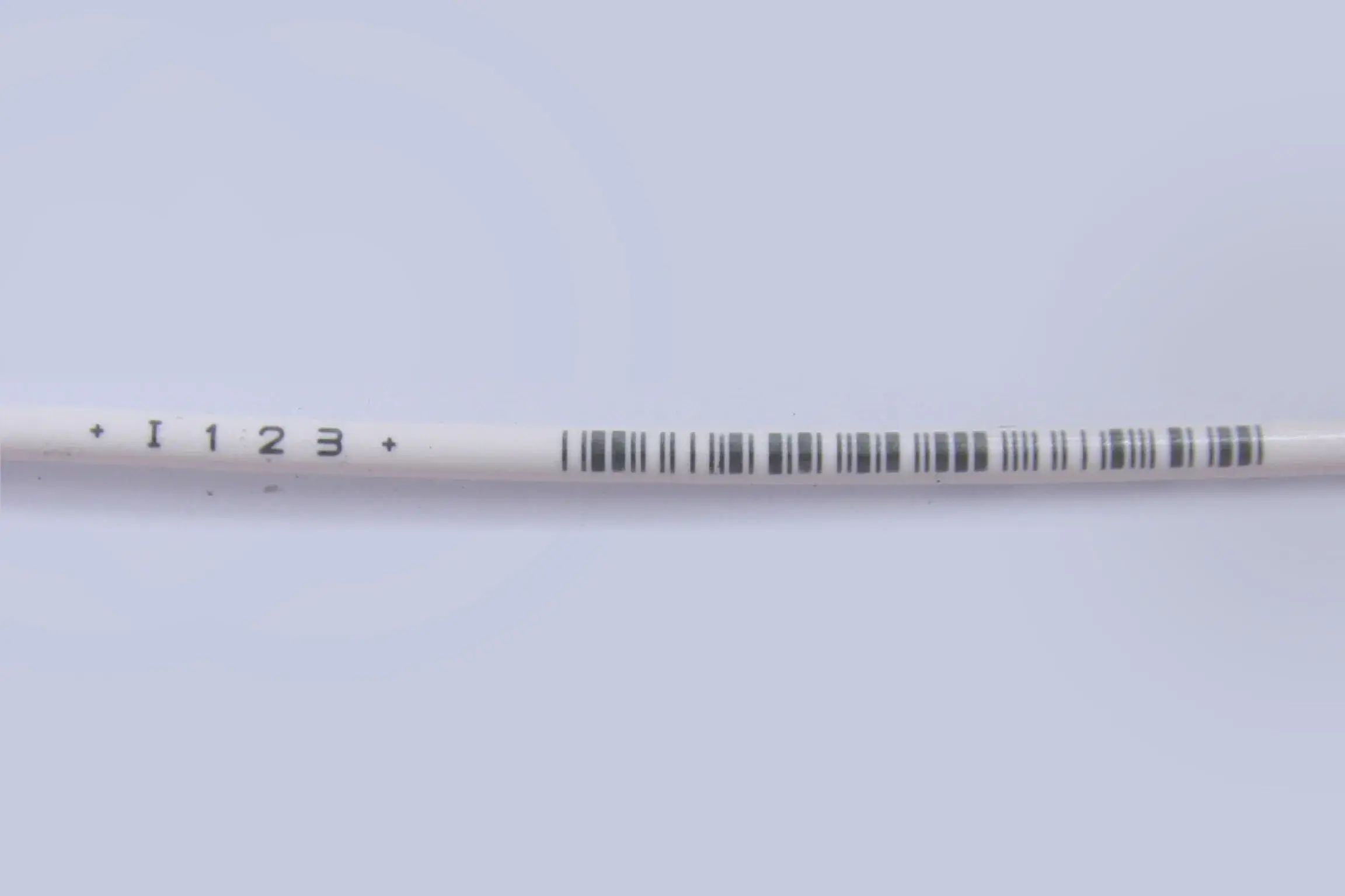 I 1 2 3 Black lines on white colored wrapper.